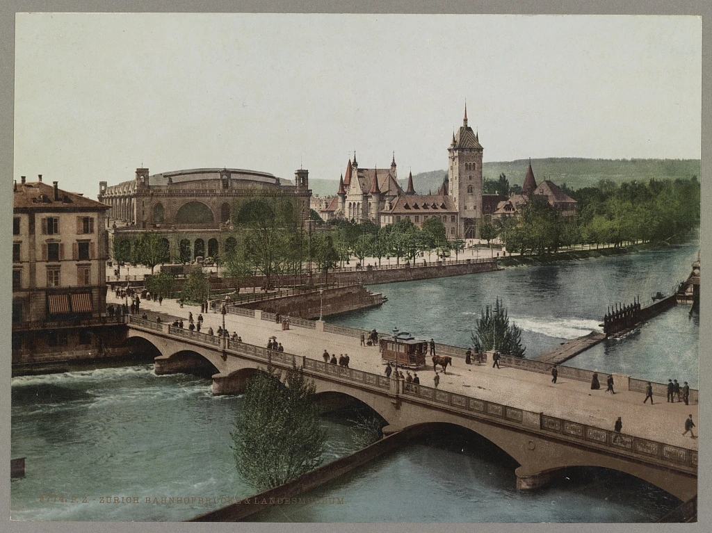 Historischer farbiger Blick auf Bahnhofbrücke, Limmat und Landesmuseum in Zürich um 1890